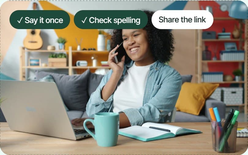A woman smiling on a call at her laptop