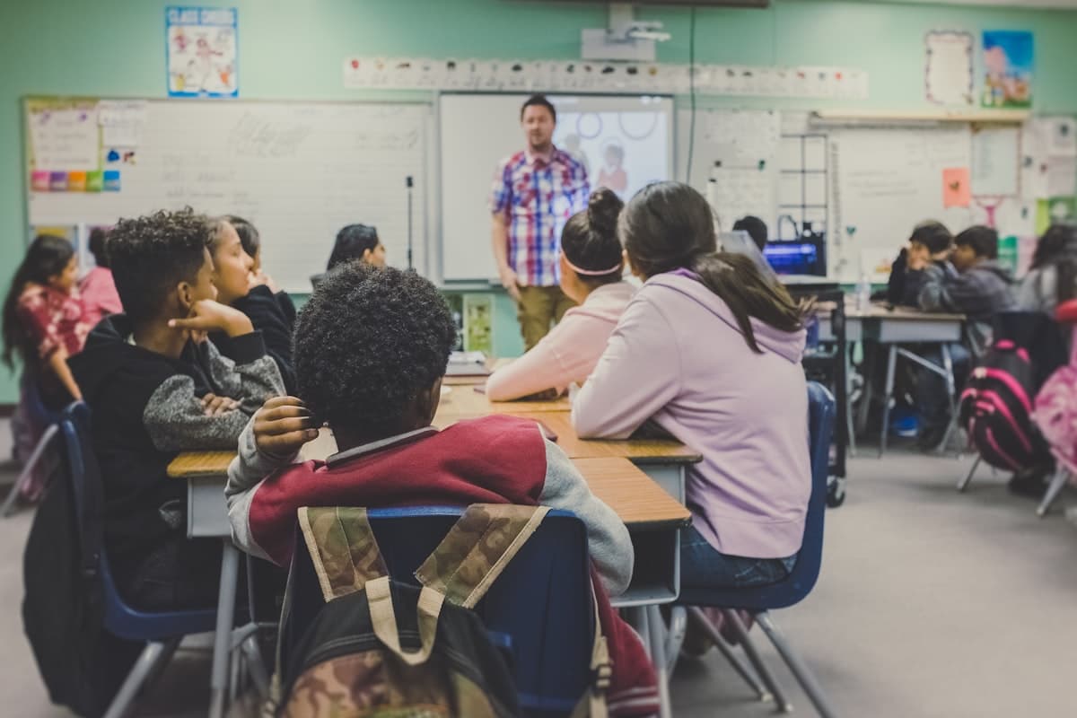 Students listening to their teacher in a classroom