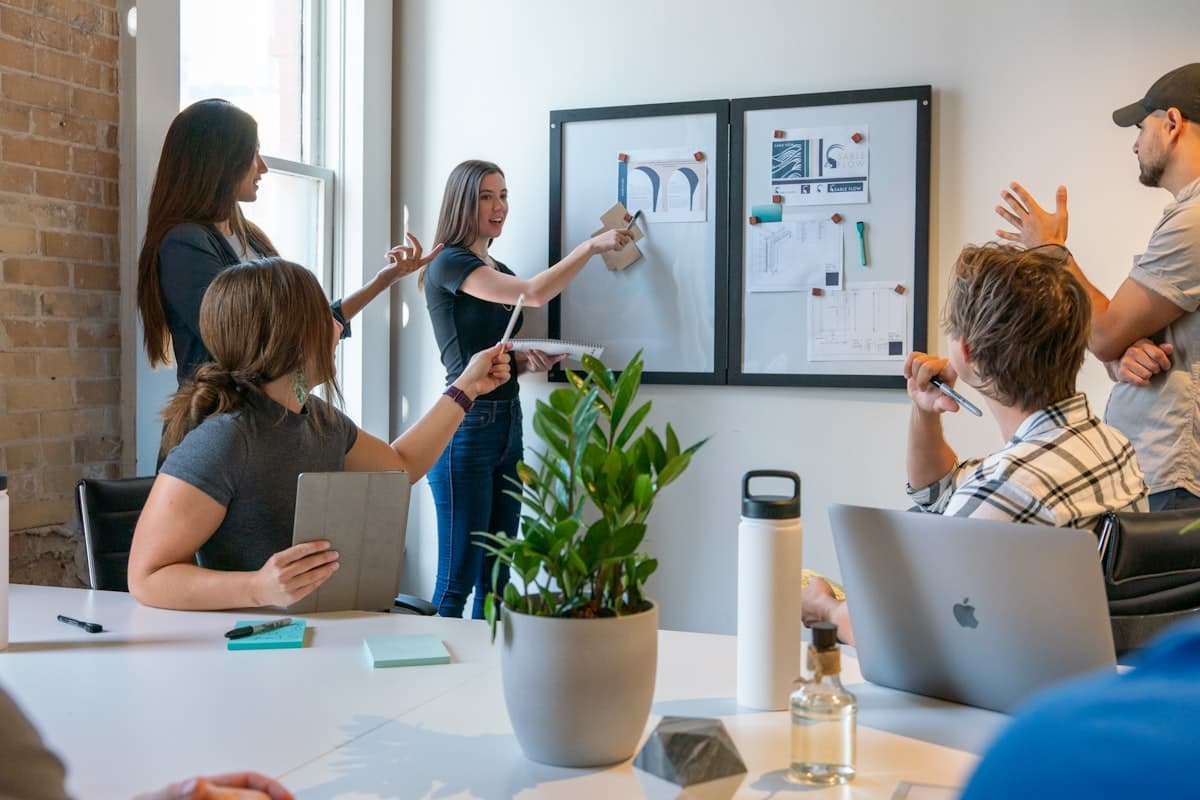 Colleagues collaborating around a table in an office